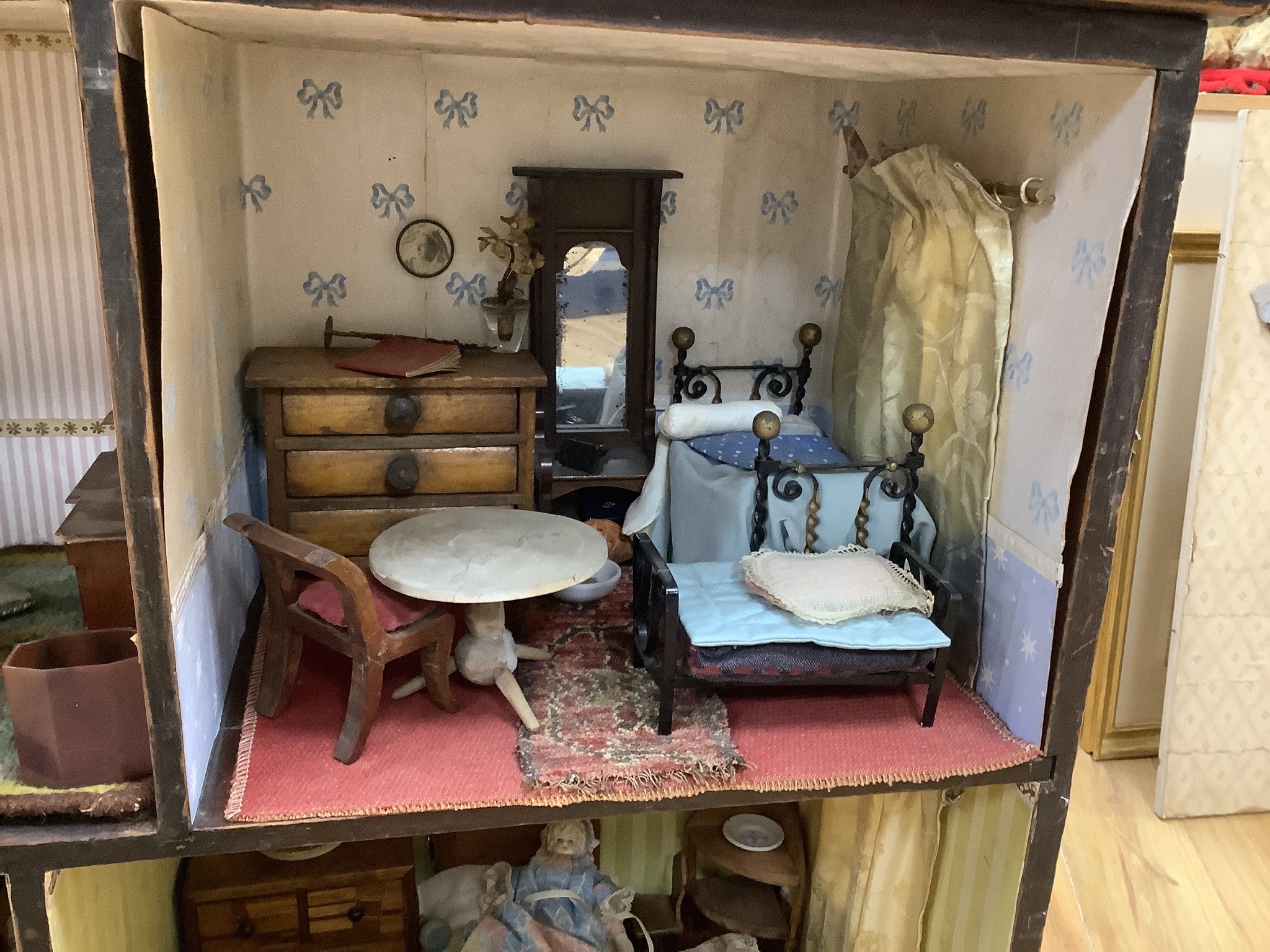 A furnished English dolls’ house, circa 1810-20, 104cm high